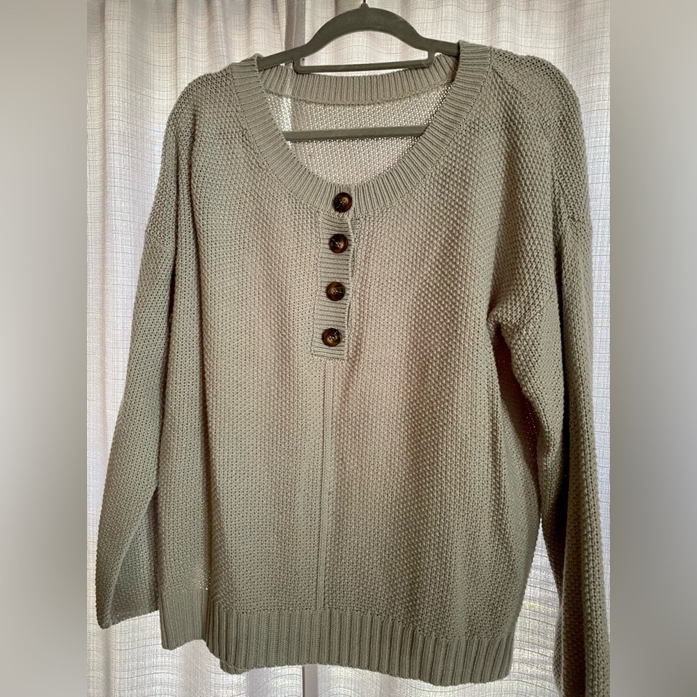 Medium gray sweater, oversized style, great with leggings or jeans.